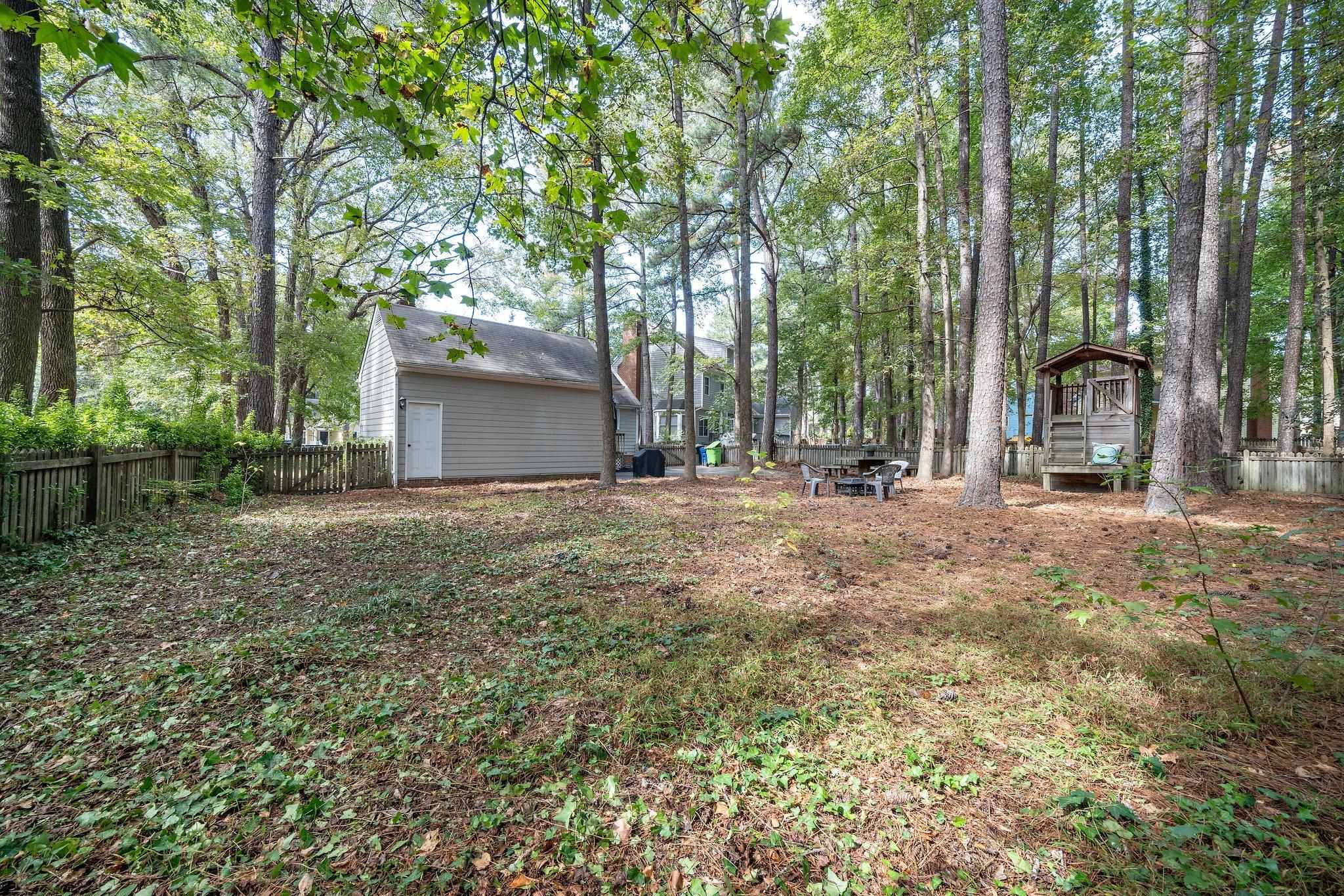 4400 Liverpool Lane Raleigh, NC 27604 - Photo 6 of 34 front view of a house with a yard and trees