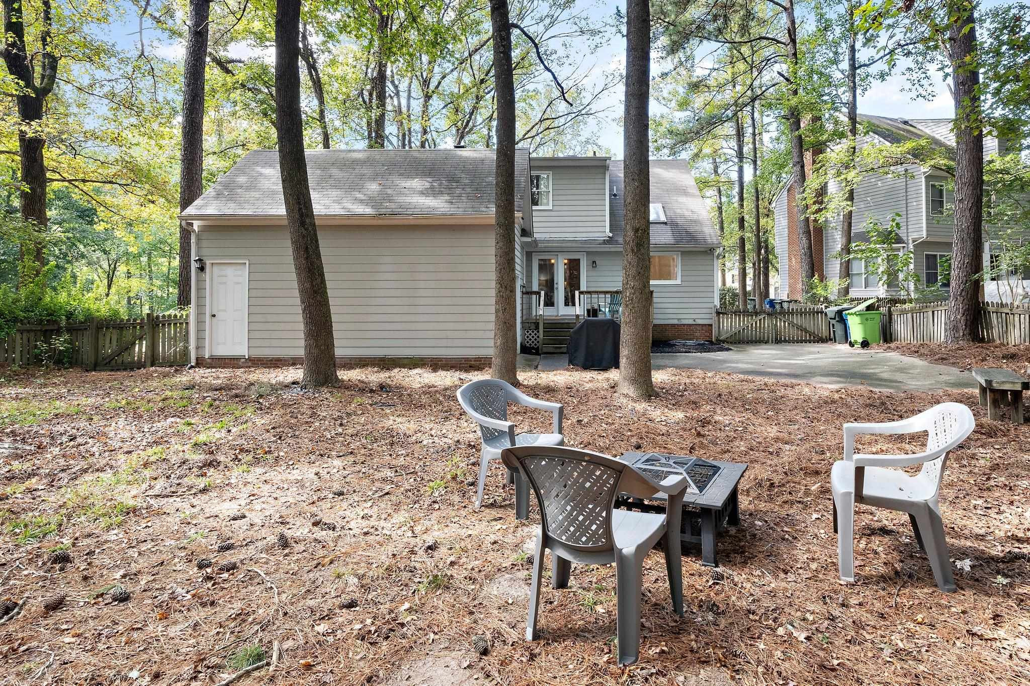 4400 Liverpool Lane Raleigh, NC 27604 - Photo 7 of 34 a view of a wooden bench sitting in backyard