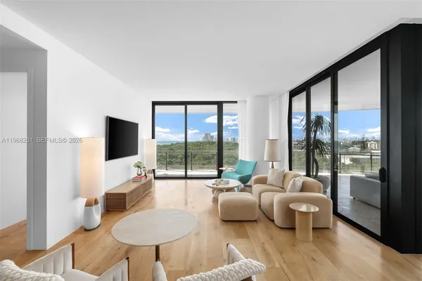 a living room with furniture and a flat screen tv