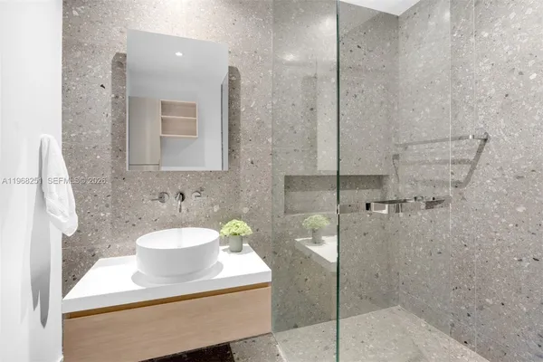 a bathroom with a shower and toilet