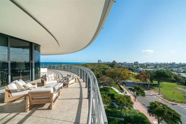 a view of a balcony with an ocean view