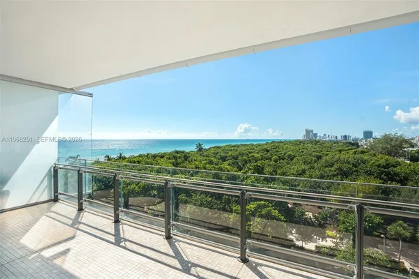 a balcony with furniture and city view