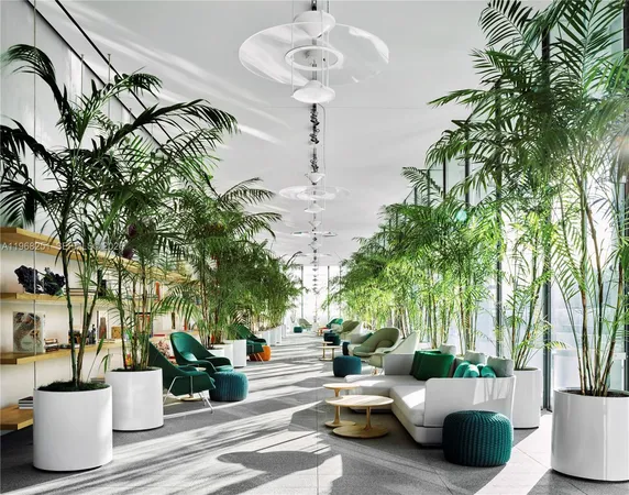 a living room with patio furniture and a potted plant