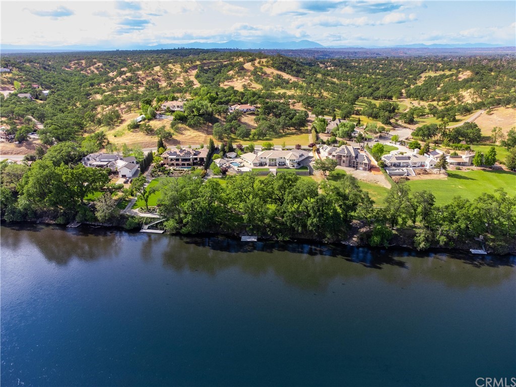 22595 Adobe Road Red Bluff, CA 96080 - Photo 16 of 71 an aerial view of residential houses with outdoor space and lake view