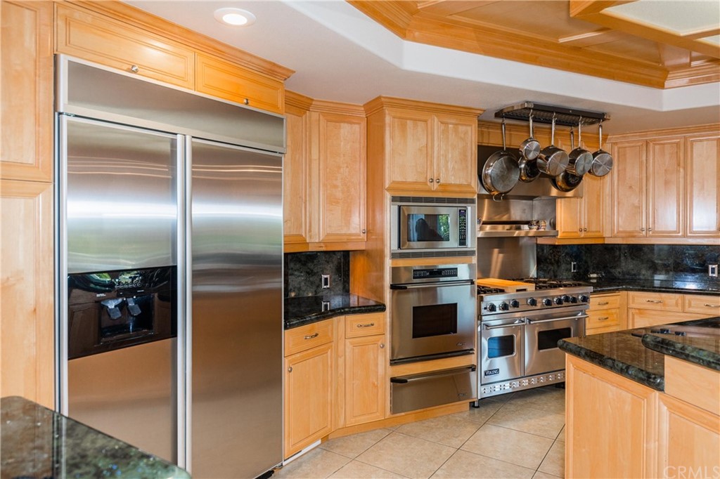 22595 Adobe Road Red Bluff, CA 96080 - Photo 39 of 71 a kitchen with stainless steel appliances granite countertop a refrigerator and a stove