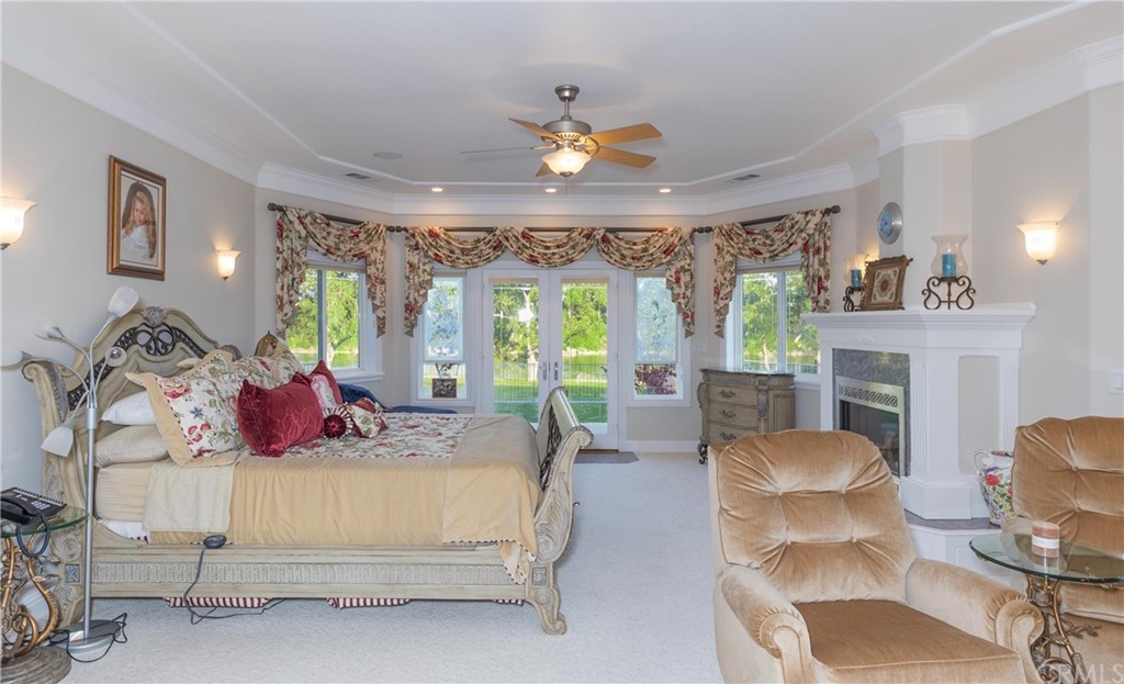 22595 Adobe Road Red Bluff, CA 96080 - Photo 50 of 71 a bedroom with furniture and a large window