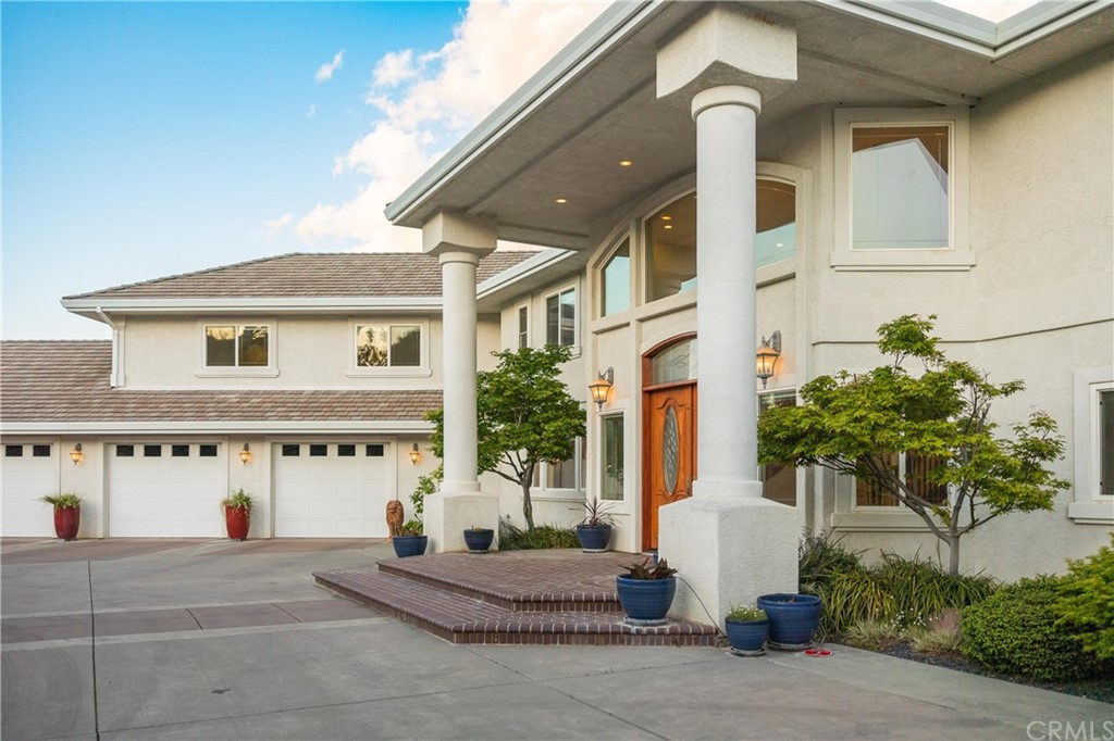 22595 Adobe Road Red Bluff, CA 96080 - Photo 5 of 71 a front view of a house with a yard and garage