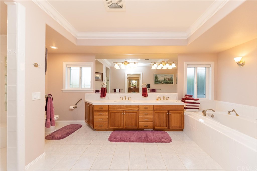 22595 Adobe Road Red Bluff, CA 96080 - Photo 51 of 71 a large white tub sitting in a bathroom next to a sink