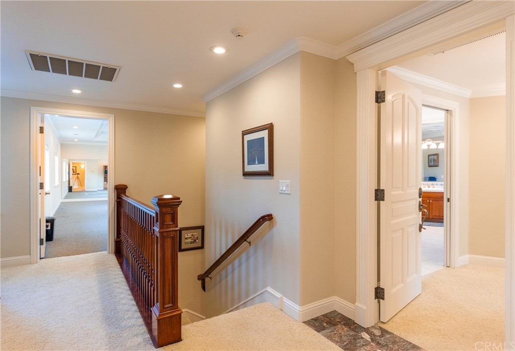 22595 Adobe Road Red Bluff, CA 96080 - Photo 53 of 71 a view of a hallway with paintings on the wall