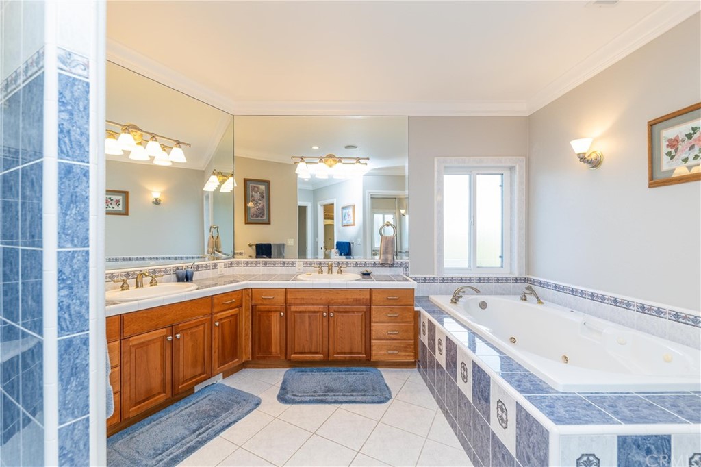 22595 Adobe Road Red Bluff, CA 96080 - Photo 58 of 71 a large bathroom with a large tub and sink