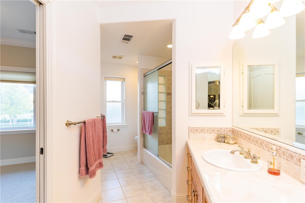 22595 Adobe Road Red Bluff, CA 96080 - Photo 65 of 71 a bathroom with a tub sink and mirror
