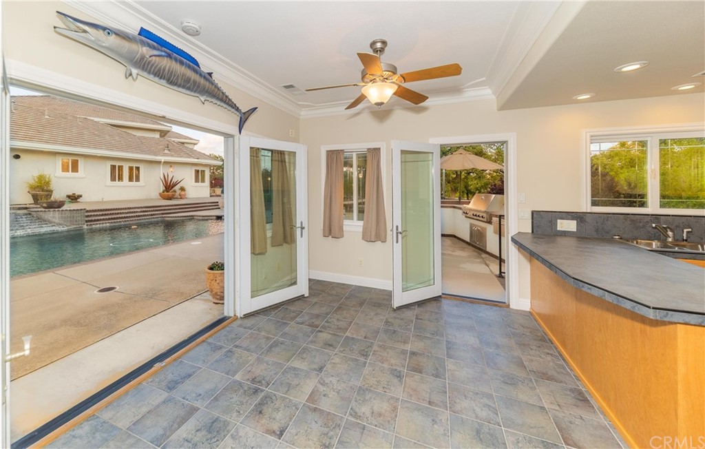 22595 Adobe Road Red Bluff, CA 96080 - Photo 69 of 71 a view of a living room and kitchen with a large window