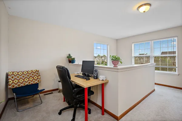 a bedroom with furniture and a flat screen tv