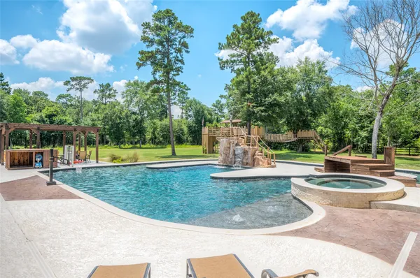 a view of a swimming pool with a sitting space