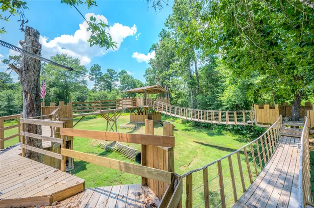 a view of balcony with wooden floor and outdoor seating