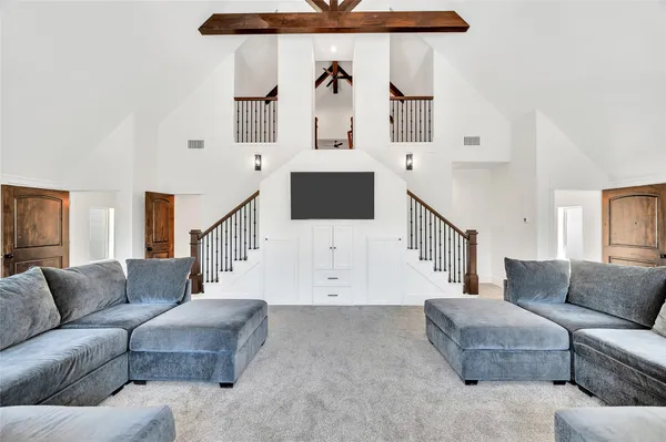a living room with furniture and white walls