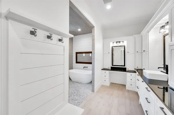 a large white room with a couch and a stove top oven