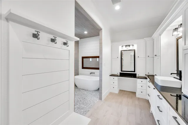 a large white room with a couch and a stove top oven