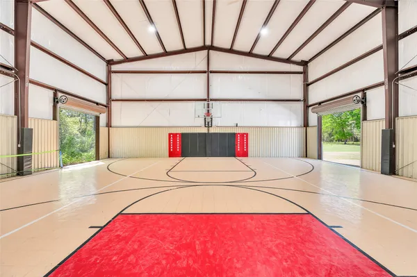 a view of a room with furniture and window