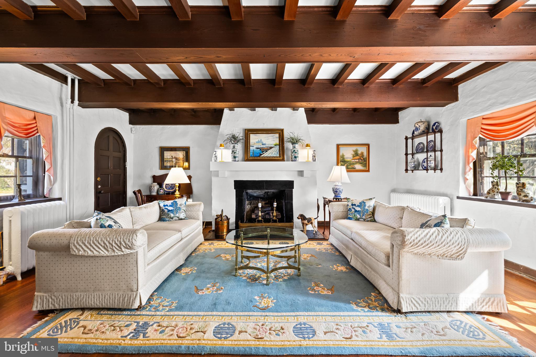 4309 Wendover Road Baltimore, MD 21218 - Photo 11 of 56 a living room with furniture and a fireplace