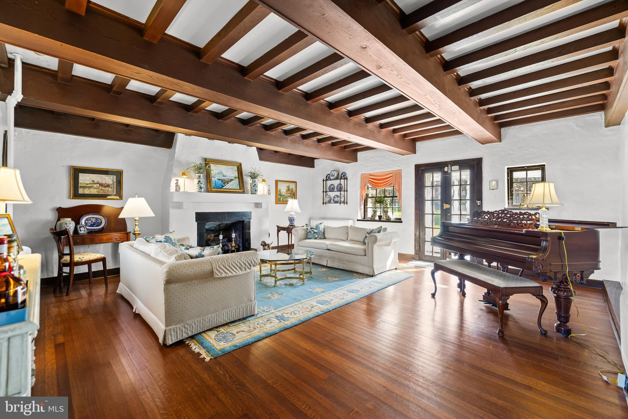 4309 Wendover Road Baltimore, MD 21218 - Photo 12 of 56 a living room with furniture and a fireplace