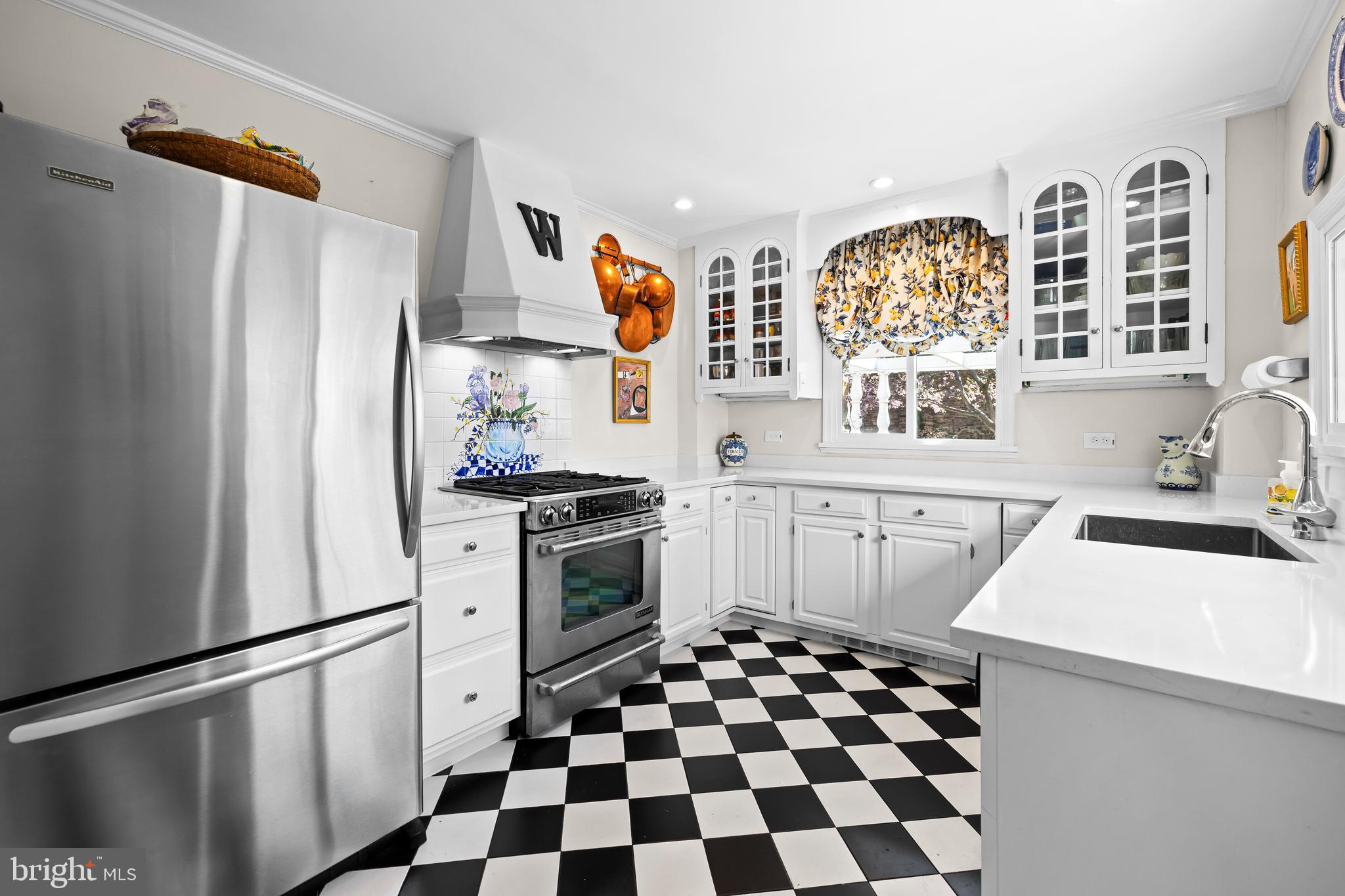 4309 Wendover Road Baltimore, MD 21218 - Photo 25 of 56 a kitchen with stainless steel appliances a refrigerator sink and stove top oven