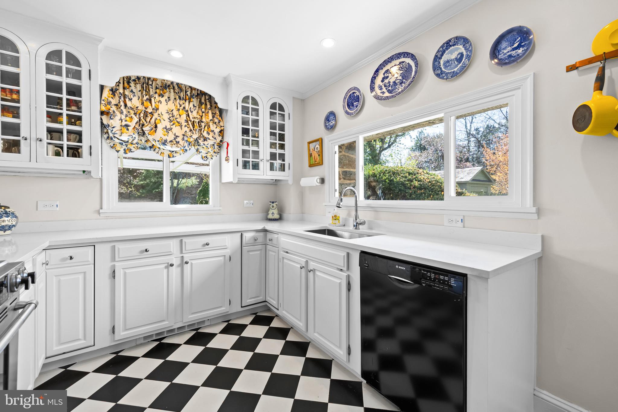 4309 Wendover Road Baltimore, MD 21218 - Photo 27 of 56 a kitchen with a stove a sink and a window