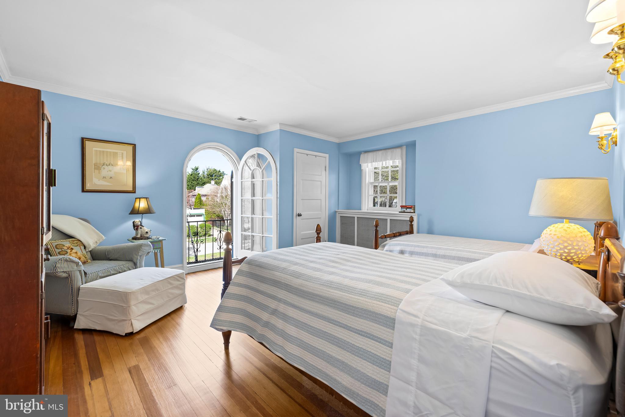 4309 Wendover Road Baltimore, MD 21218 - Photo 32 of 56 a bedroom with a bed and wooden floor