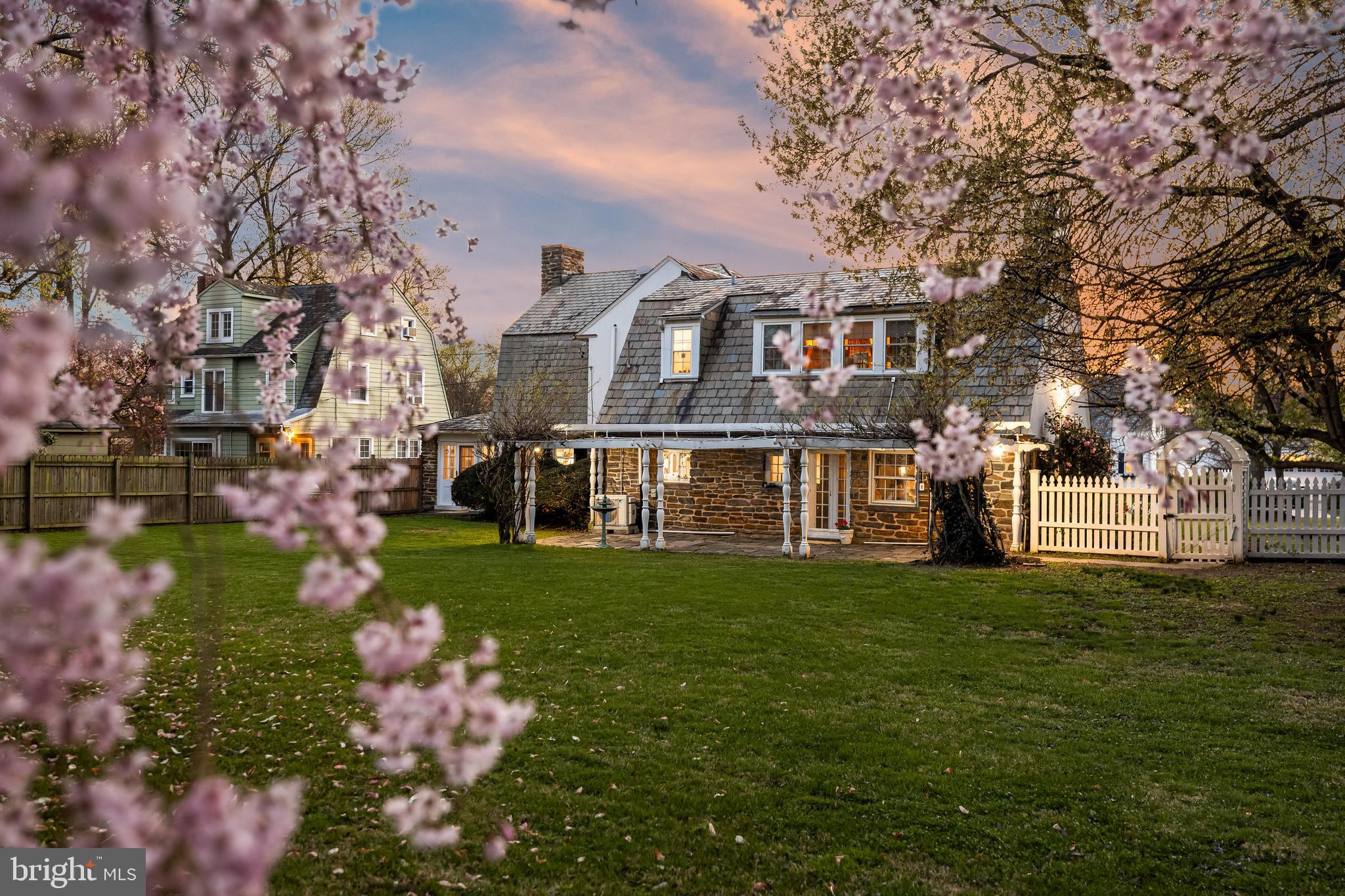 4309 Wendover Road Baltimore, MD 21218 - Photo 4 of 56 a front view of a house with a yard and trees