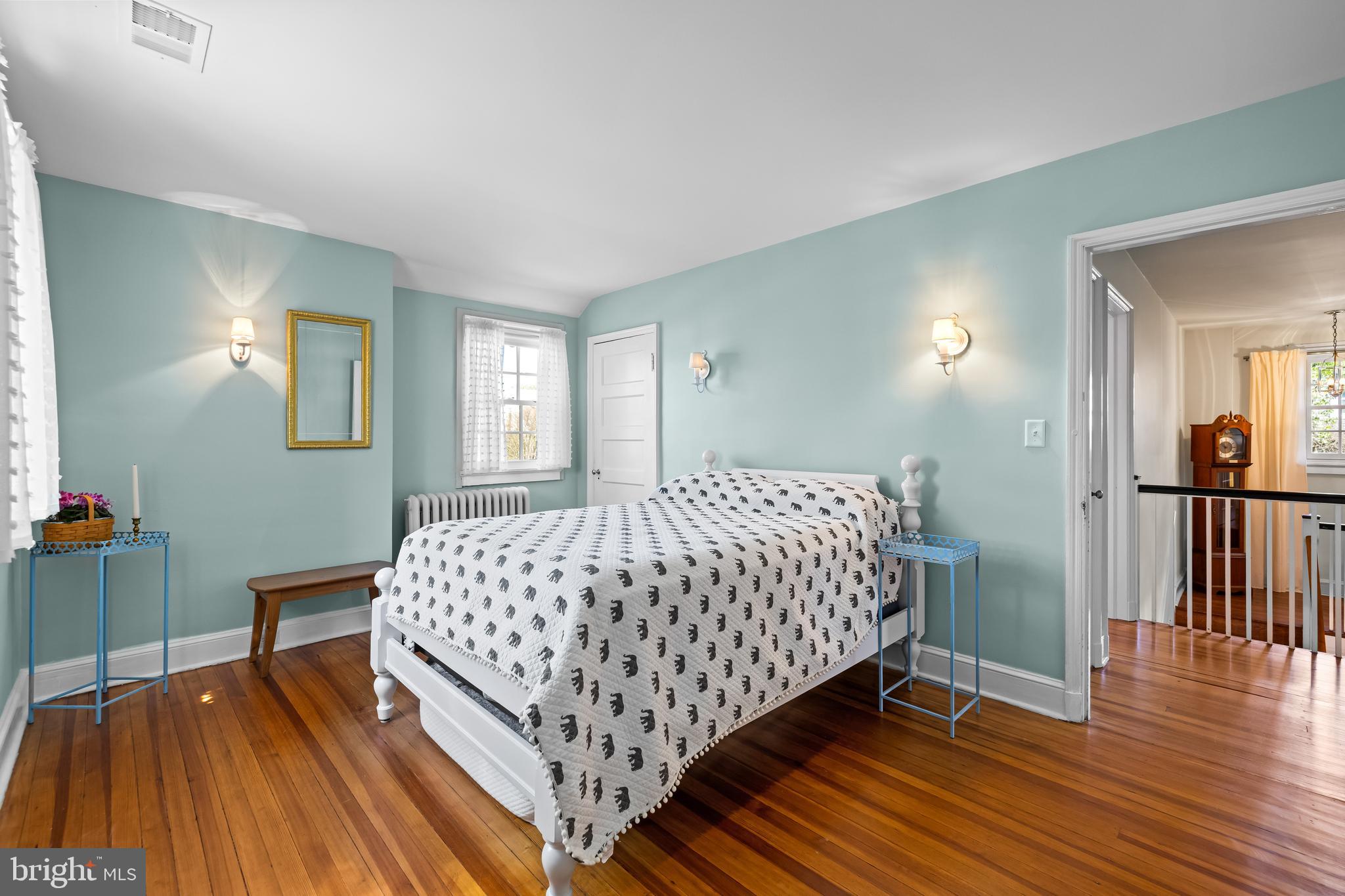 4309 Wendover Road Baltimore, MD 21218 - Photo 42 of 56 a bedroom with a bed and wooden floor