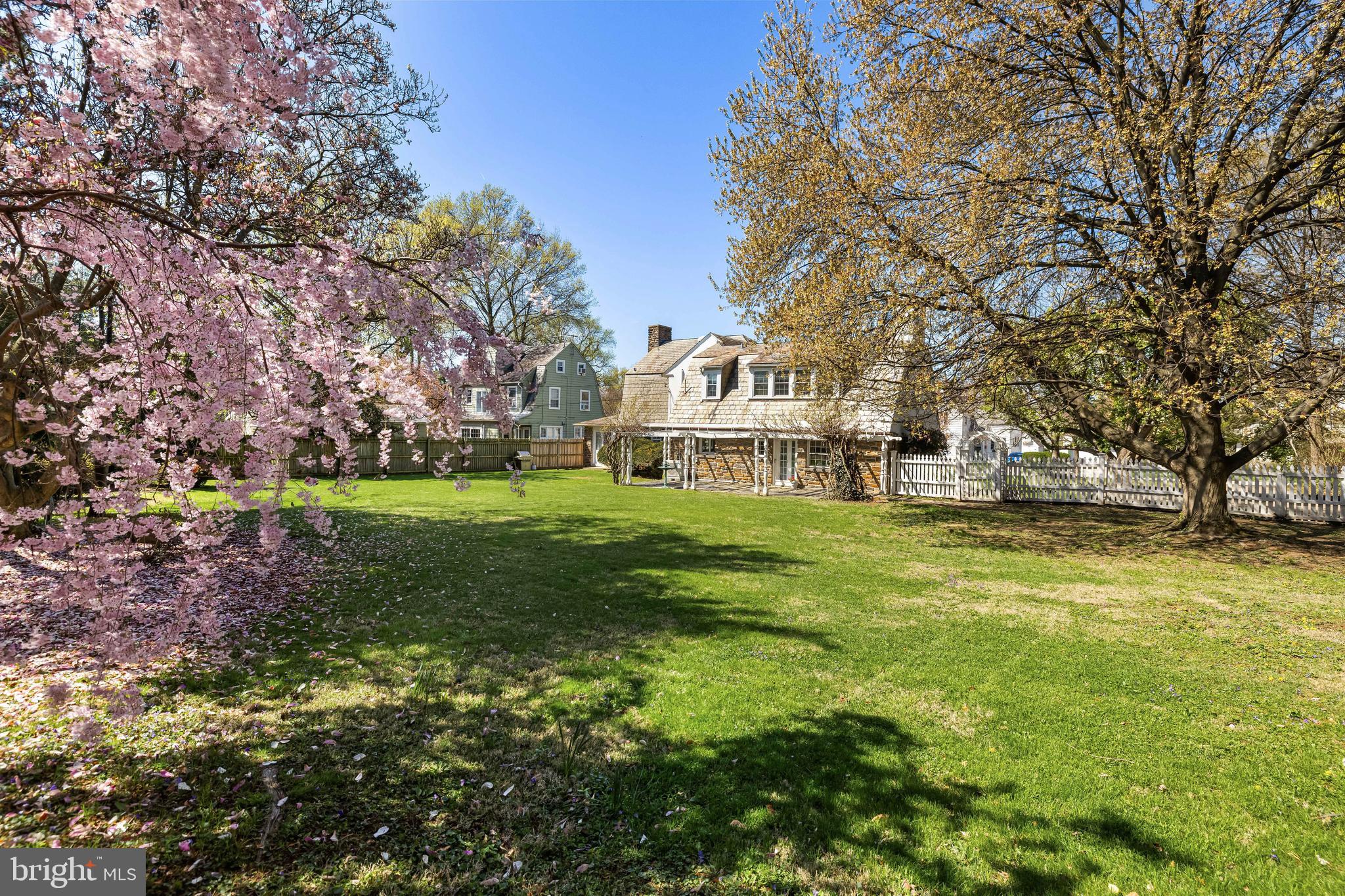 4309 Wendover Road Baltimore, MD 21218 - Photo 48 of 56 a view of a house with a big yard and large trees