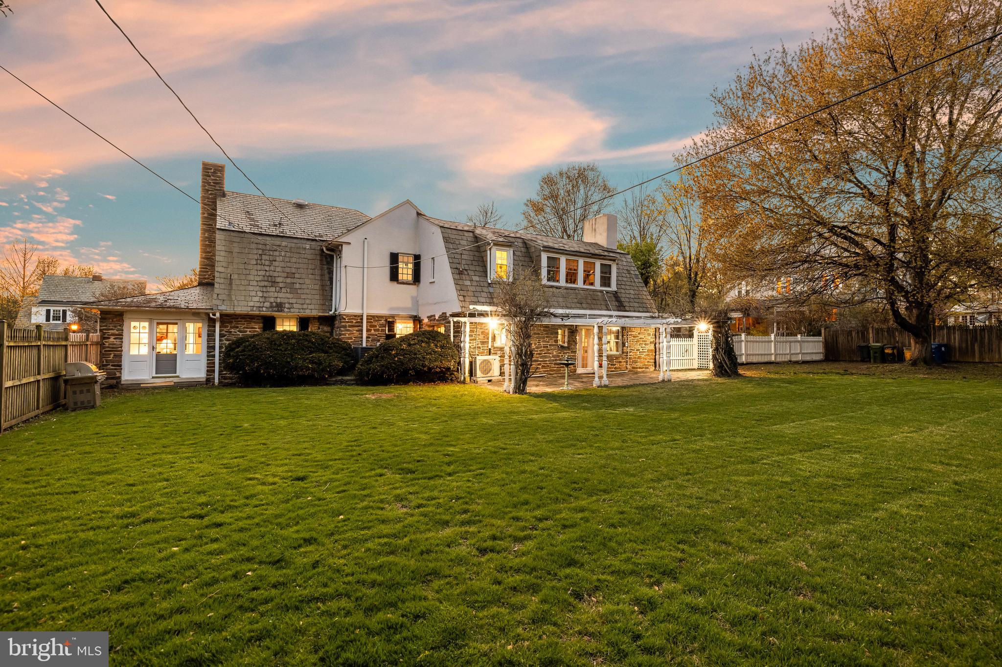 4309 Wendover Road Baltimore, MD 21218 - Photo 6 of 56 a front view of a house with a garden