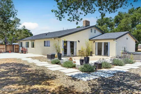 a house view with a garden space