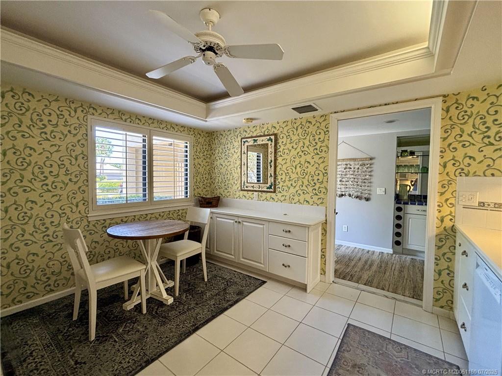 5152 Southeast Club Way, Unit 104 Stuart, FL 34997 - Photo 7 of 28 a dining room with furniture and window