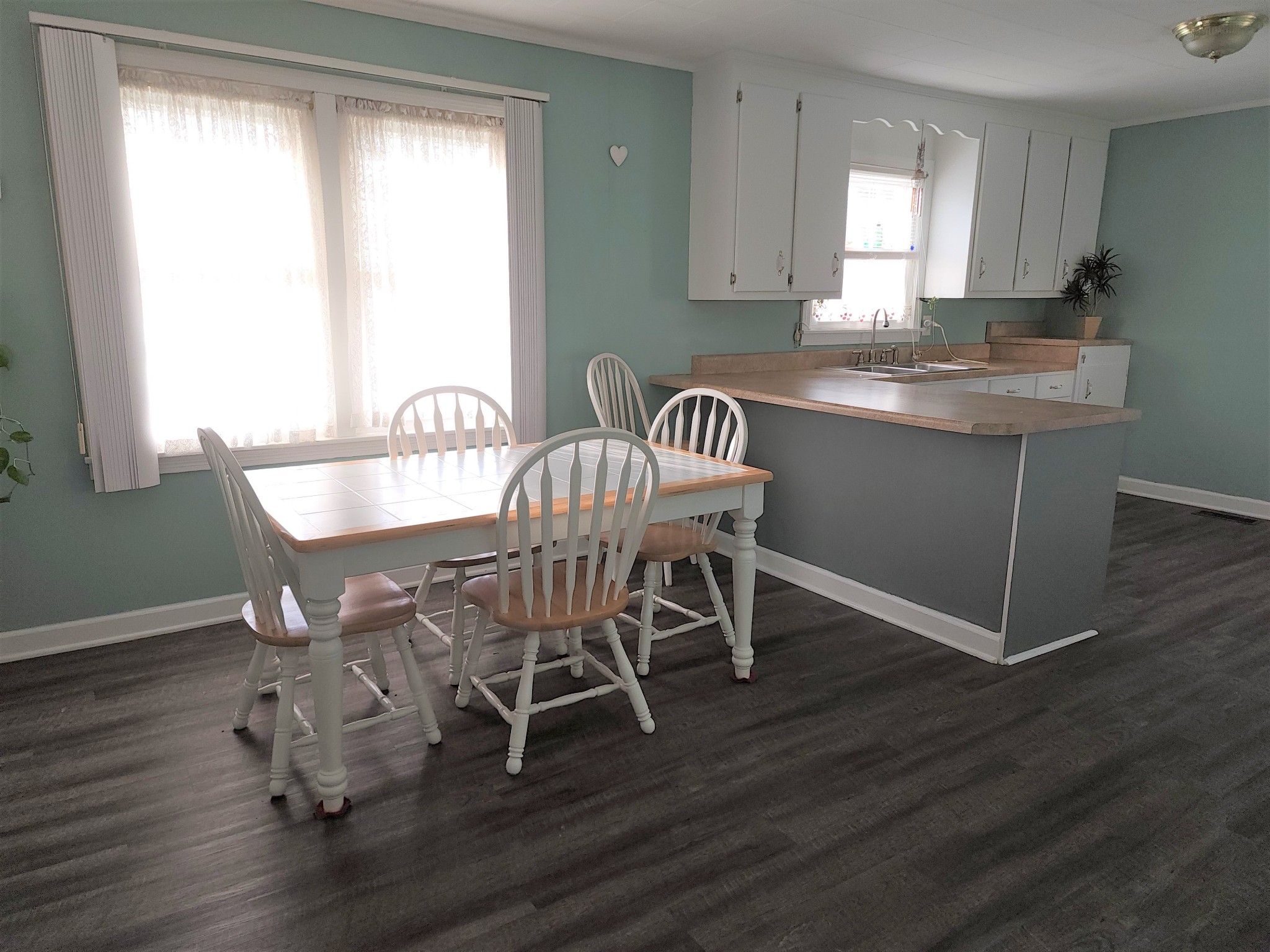 894 West Point Road Lawrenceburg, TN 38464 - Photo 4 of 26 a view of a dining room with furniture and wooden floor