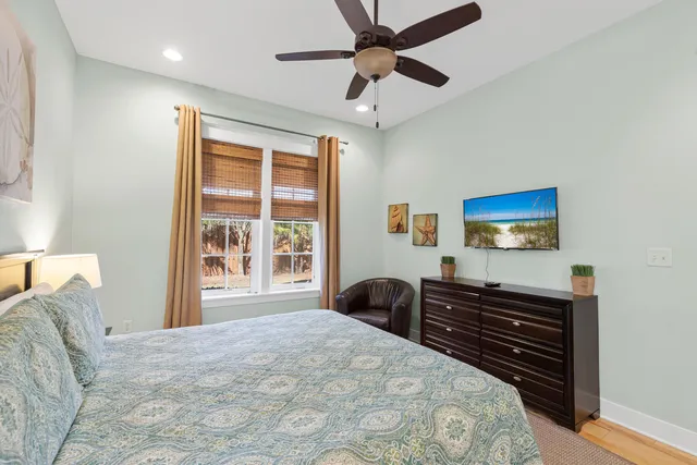 a bedroom with a bed and a dresser