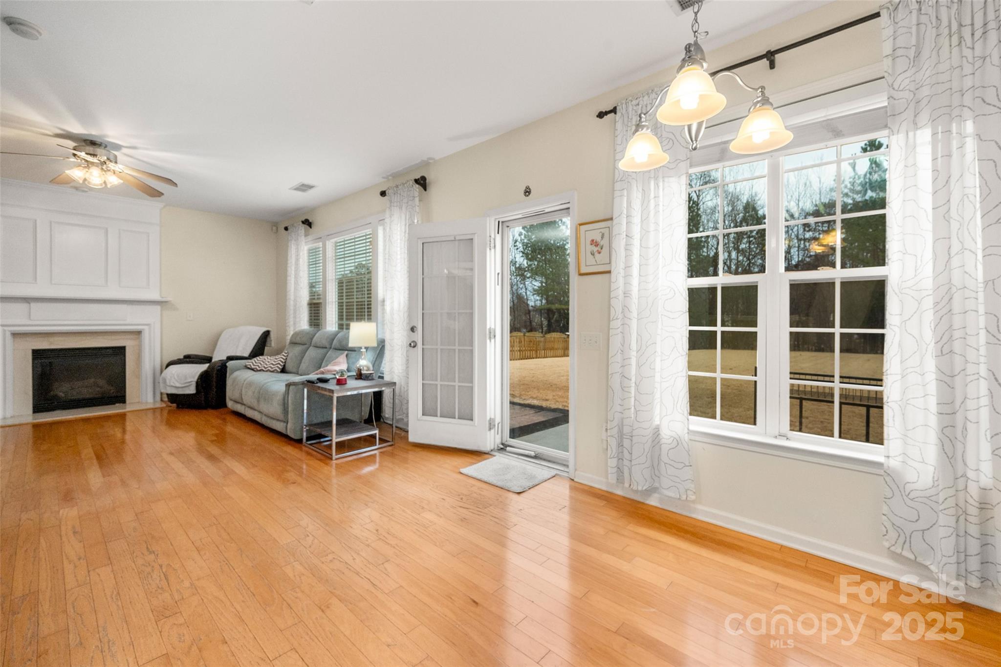2223 Blueberry Ridge Road Matthews, NC 28105 - Photo 13 of 25 a living room with furniture window and a fireplace