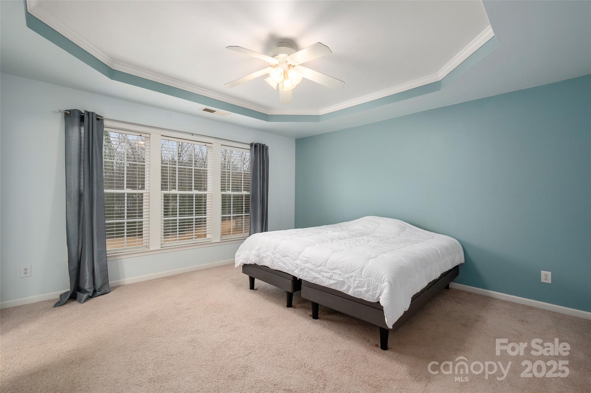 2223 Blueberry Ridge Road Matthews, NC 28105 - Photo 15 of 25 a bed sitting in a room next to a window