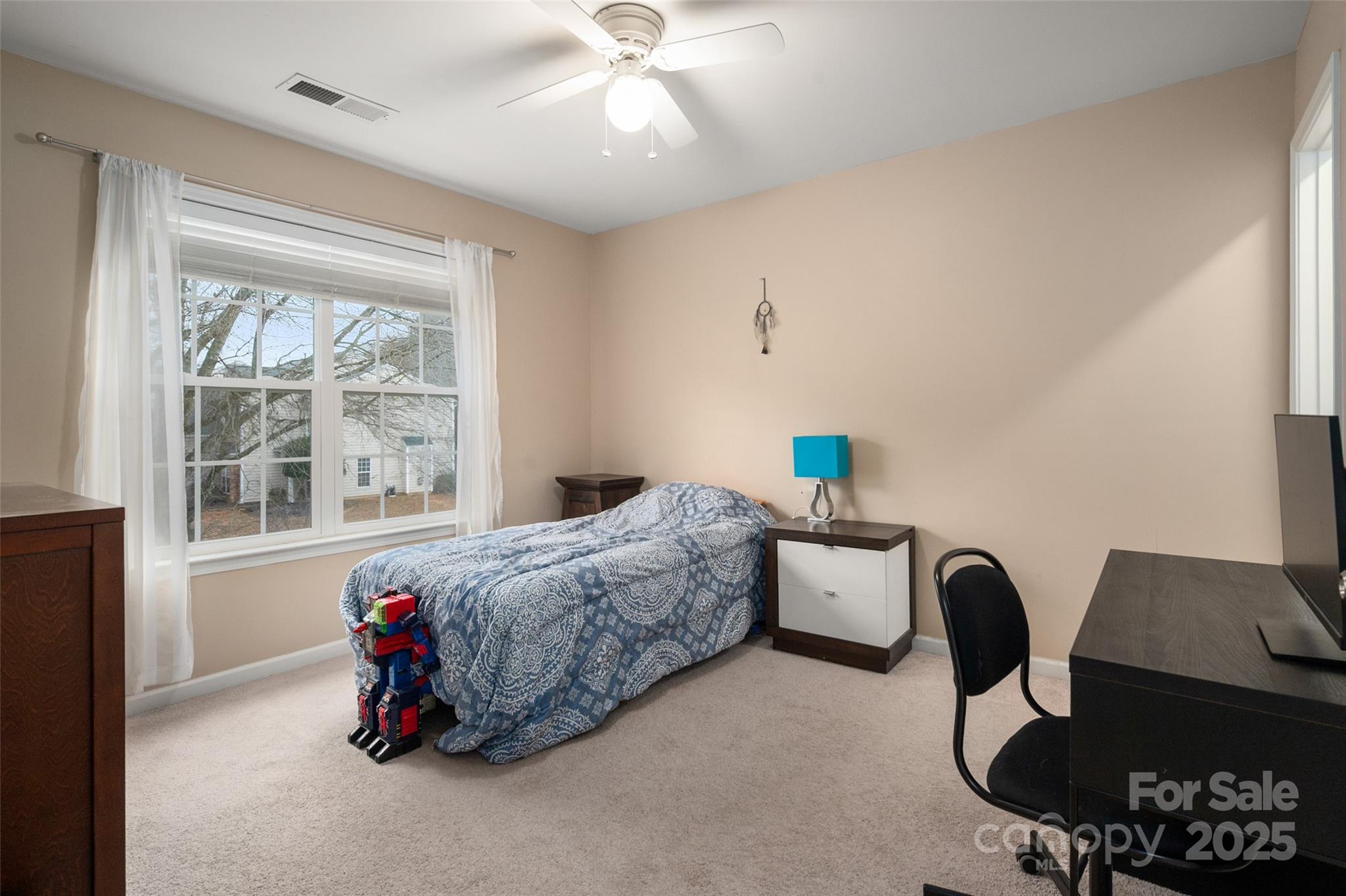 2223 Blueberry Ridge Road Matthews, NC 28105 - Photo 20 of 25 a bedroom with furniture and a window