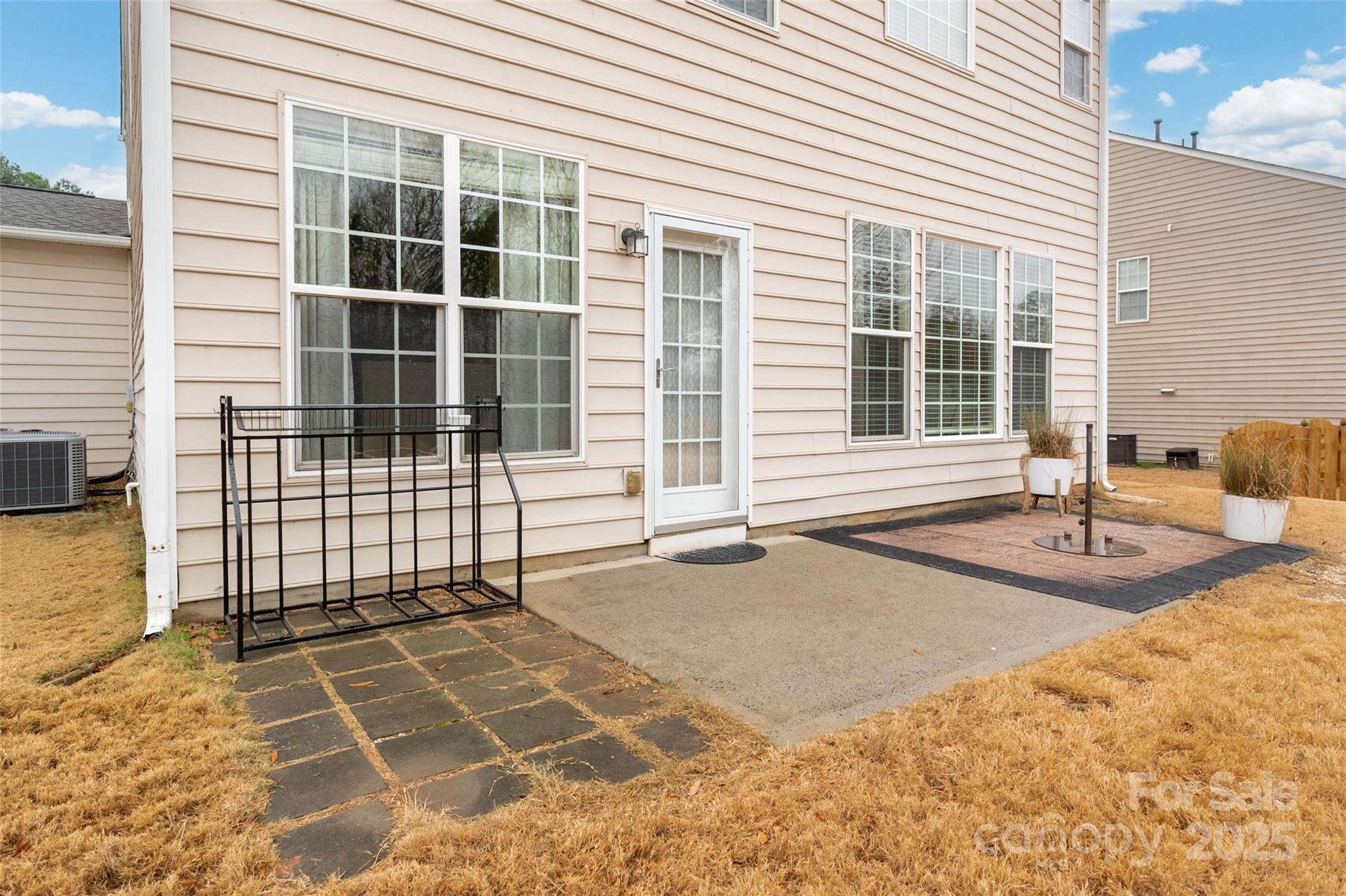 2223 Blueberry Ridge Road Matthews, NC 28105 - Photo 22 of 25 a view of a backyard with a lounge chair
