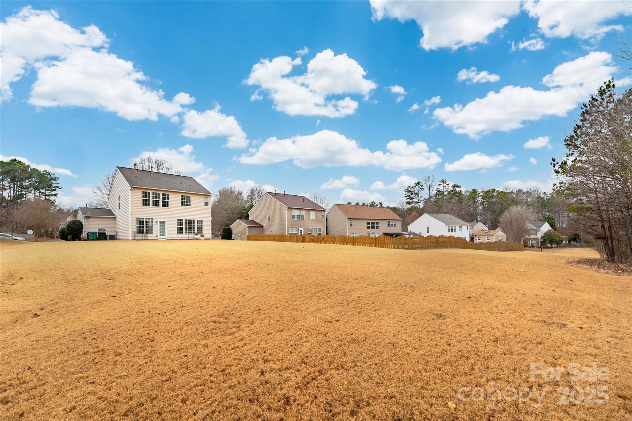 2223 Blueberry Ridge Road Matthews, NC 28105 - Photo 24 of 25 a view of a house with a yard