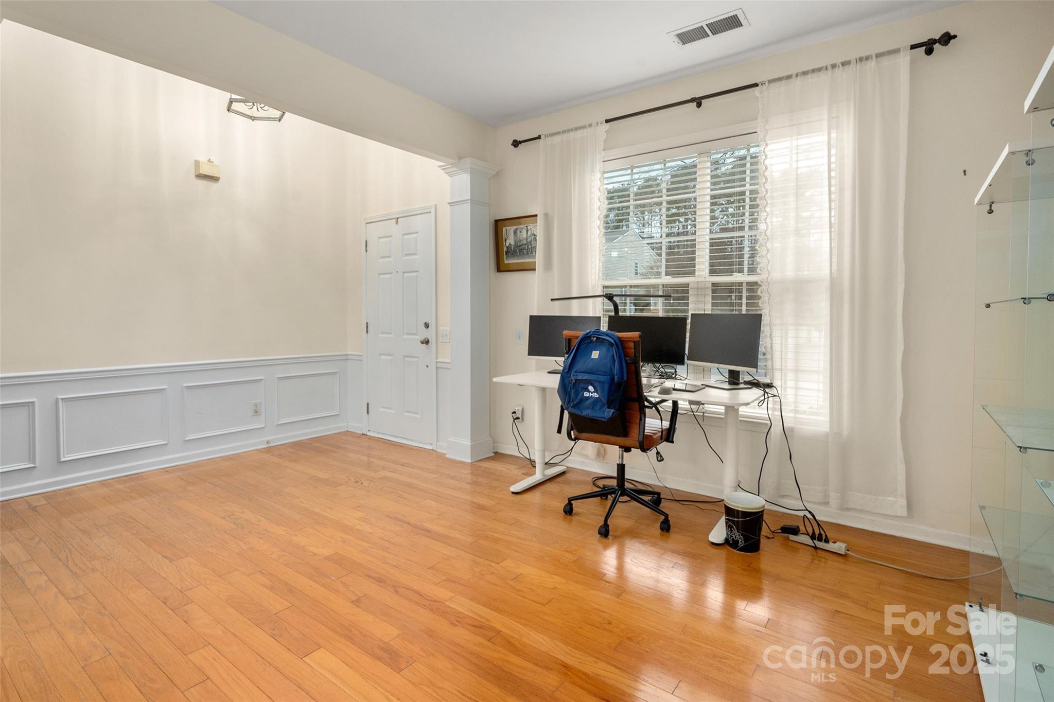2223 Blueberry Ridge Road Matthews, NC 28105 - Photo 5 of 25 a view of a workspace with furniture and a window