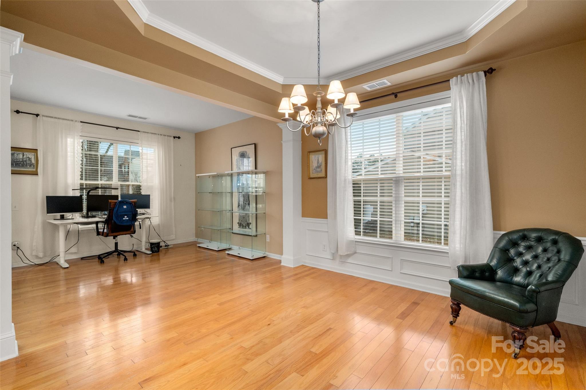 2223 Blueberry Ridge Road Matthews, NC 28105 - Photo 7 of 25 a living room with furniture and a chandelier