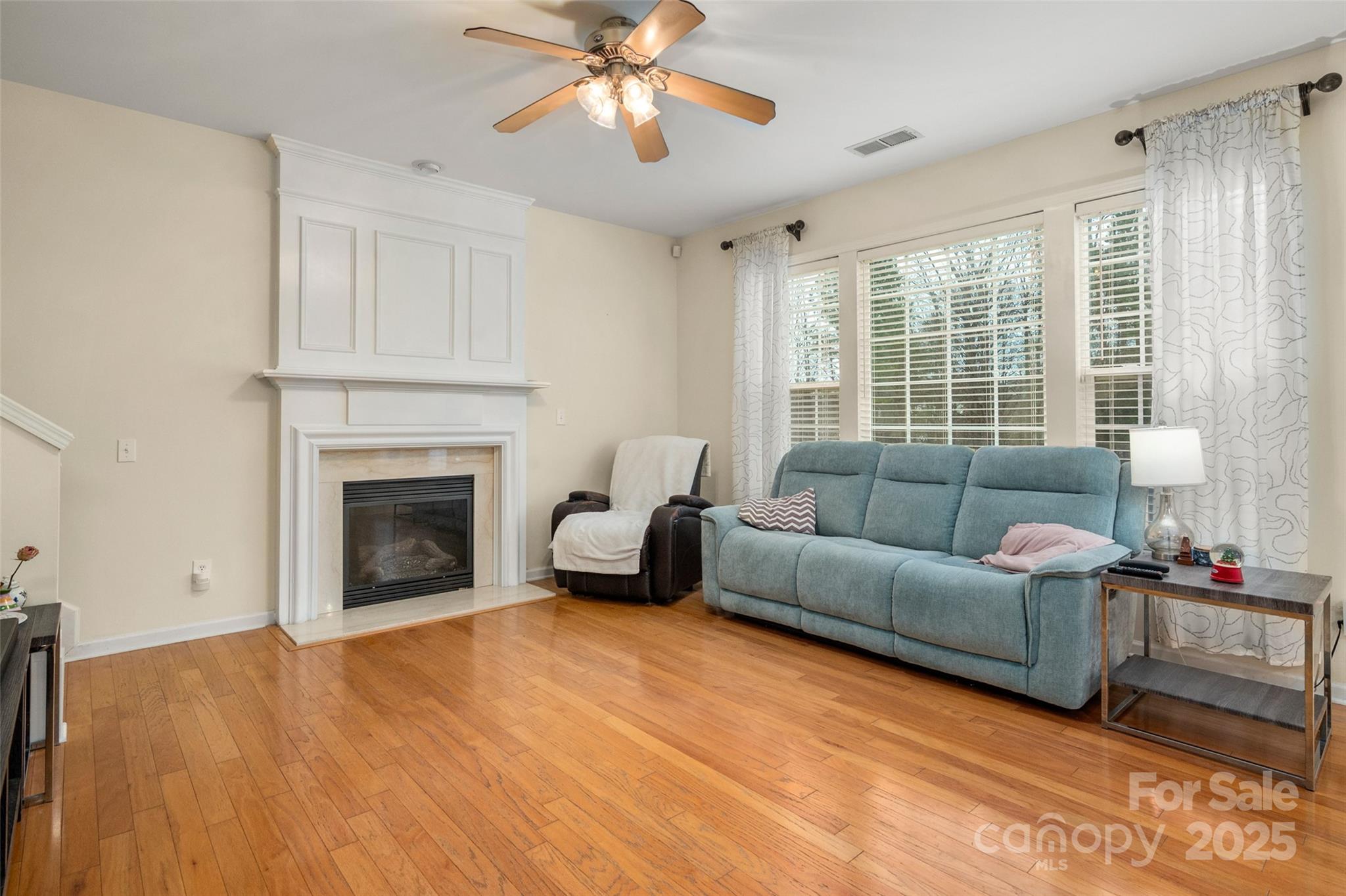 2223 Blueberry Ridge Road Matthews, NC 28105 - Photo 8 of 25 a living room with furniture and a fireplace