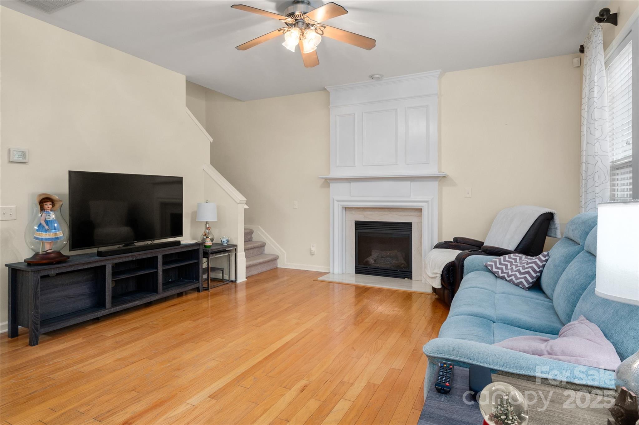 2223 Blueberry Ridge Road Matthews, NC 28105 - Photo 9 of 25 a living room with furniture and a flat screen tv