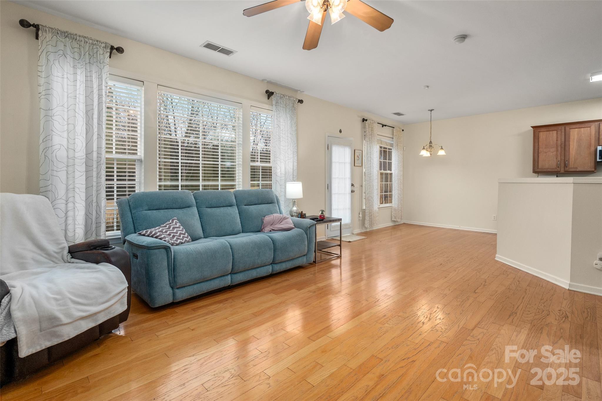 2223 Blueberry Ridge Road Matthews, NC 28105 - Photo 10 of 25 a living room with furniture and a large window