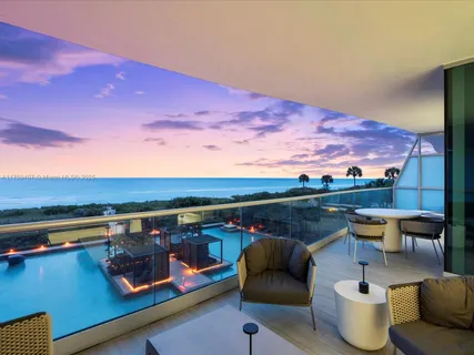 a view of city from roof deck with seating space