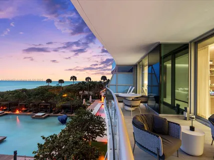 a front view of a house with outdoor seating