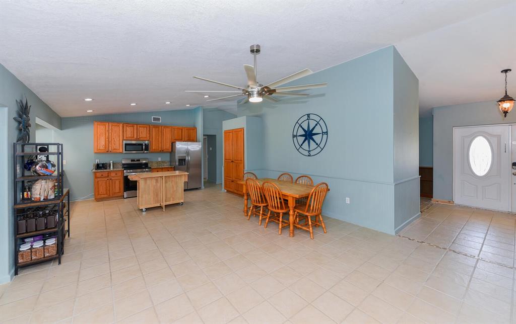 2962 Southeast Darien Road Port St. Lucie, FL 34952 - Photo 13 of 33 a view of a livingroom with furniture and a kitchen