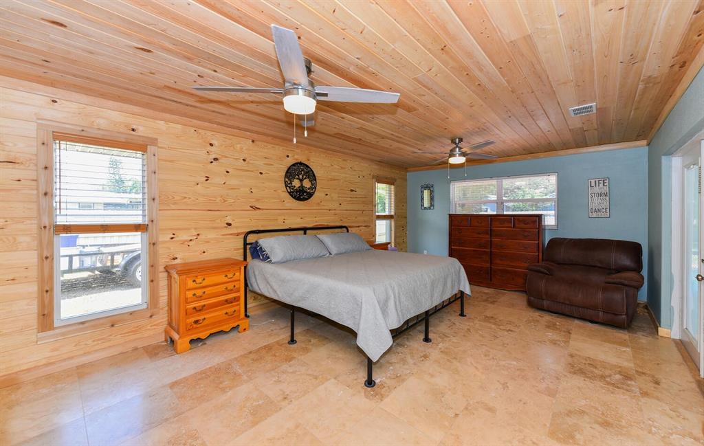 2962 Southeast Darien Road Port St. Lucie, FL 34952 - Photo 15 of 33 a bedroom with a bed and wooden floor